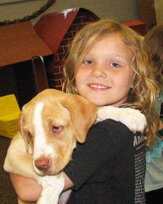 Madyson Hayes, Pittsgrove Township, age 8, brought her puppy, Nina, and told the children how to properly handle her.