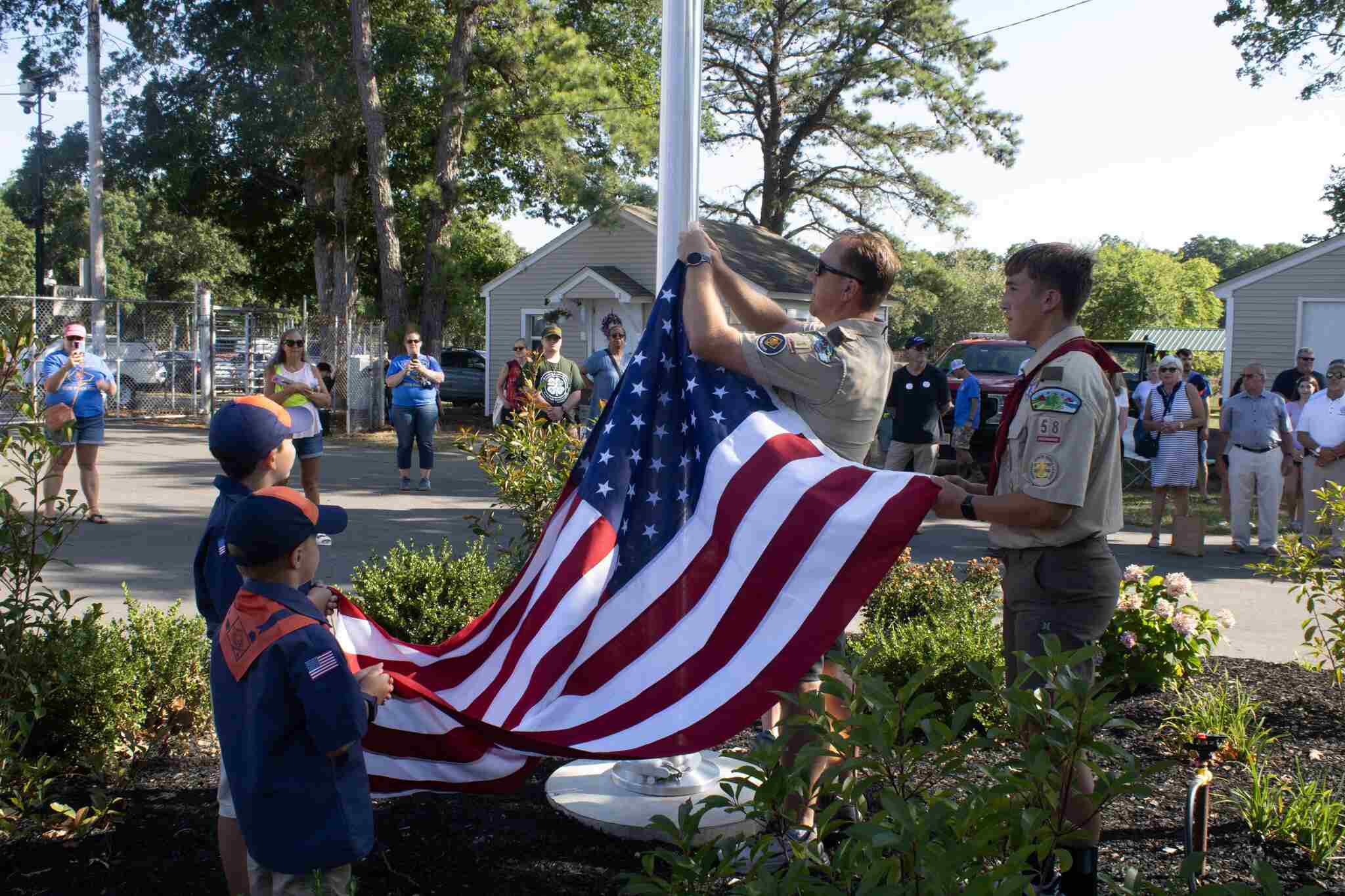 Scouts raising American Flag
